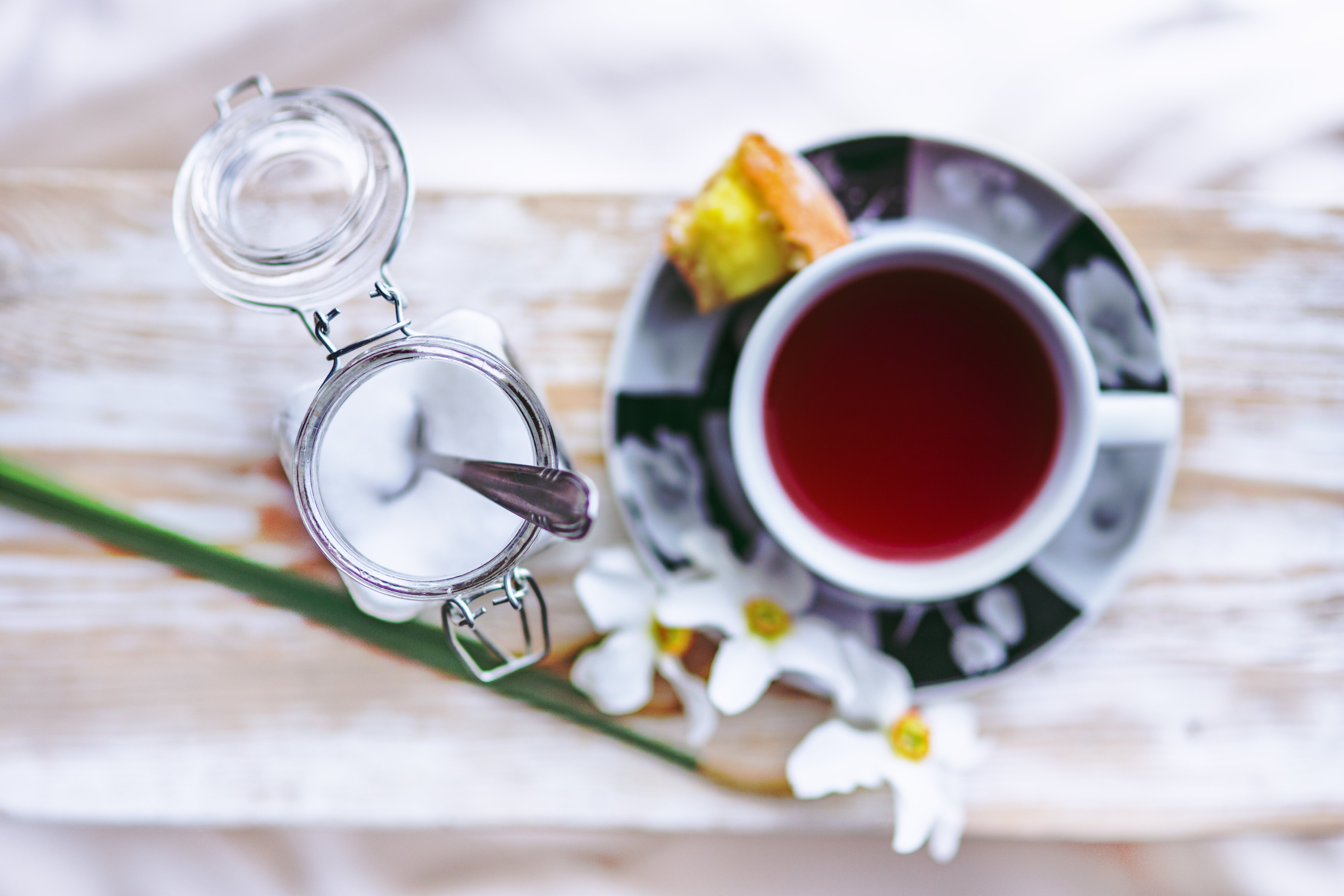 A cup of tea with berries viewed from above