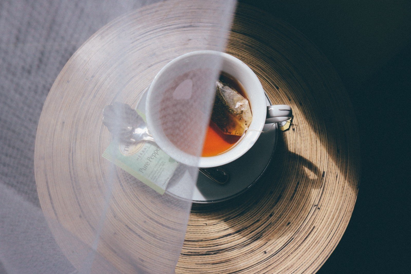A cup of tea with berries viewed from above